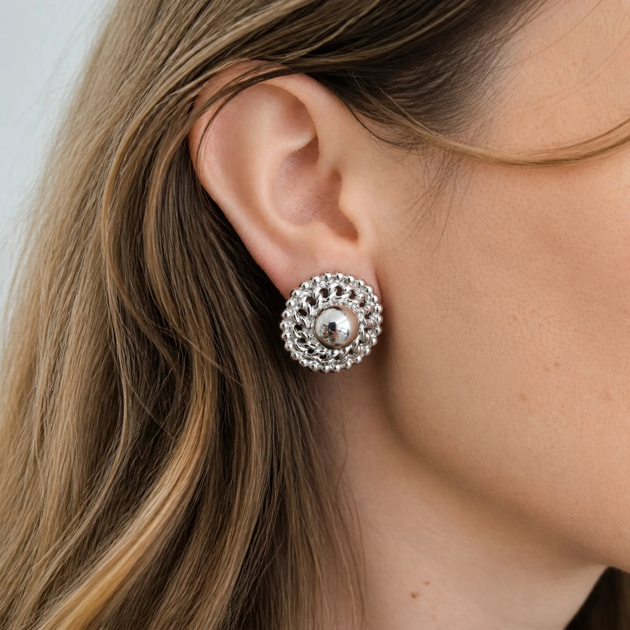 Vintage silver woven dome earrings worn on model