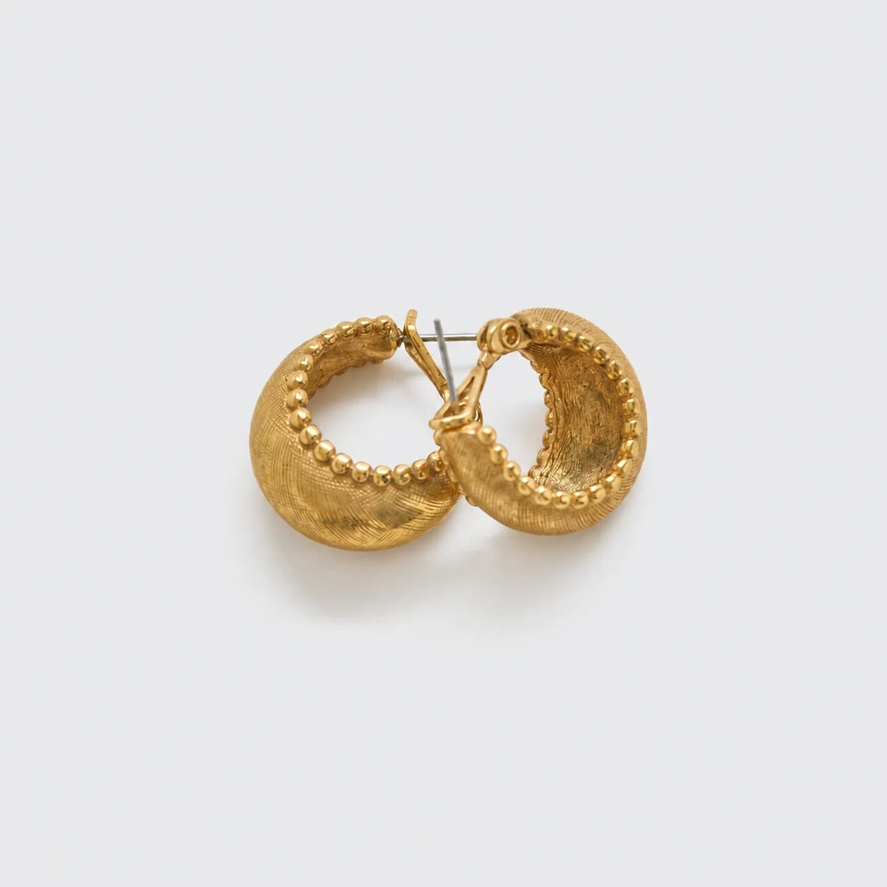 Vintage gold-tone crescent hoop earrings, side and post-back detail