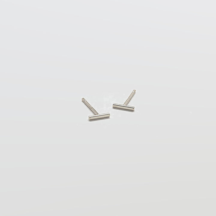 Pair of silver U-shaped earrings on a white background