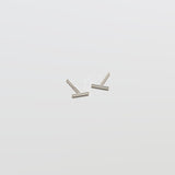 Pair of silver U-shaped earrings on a white background
