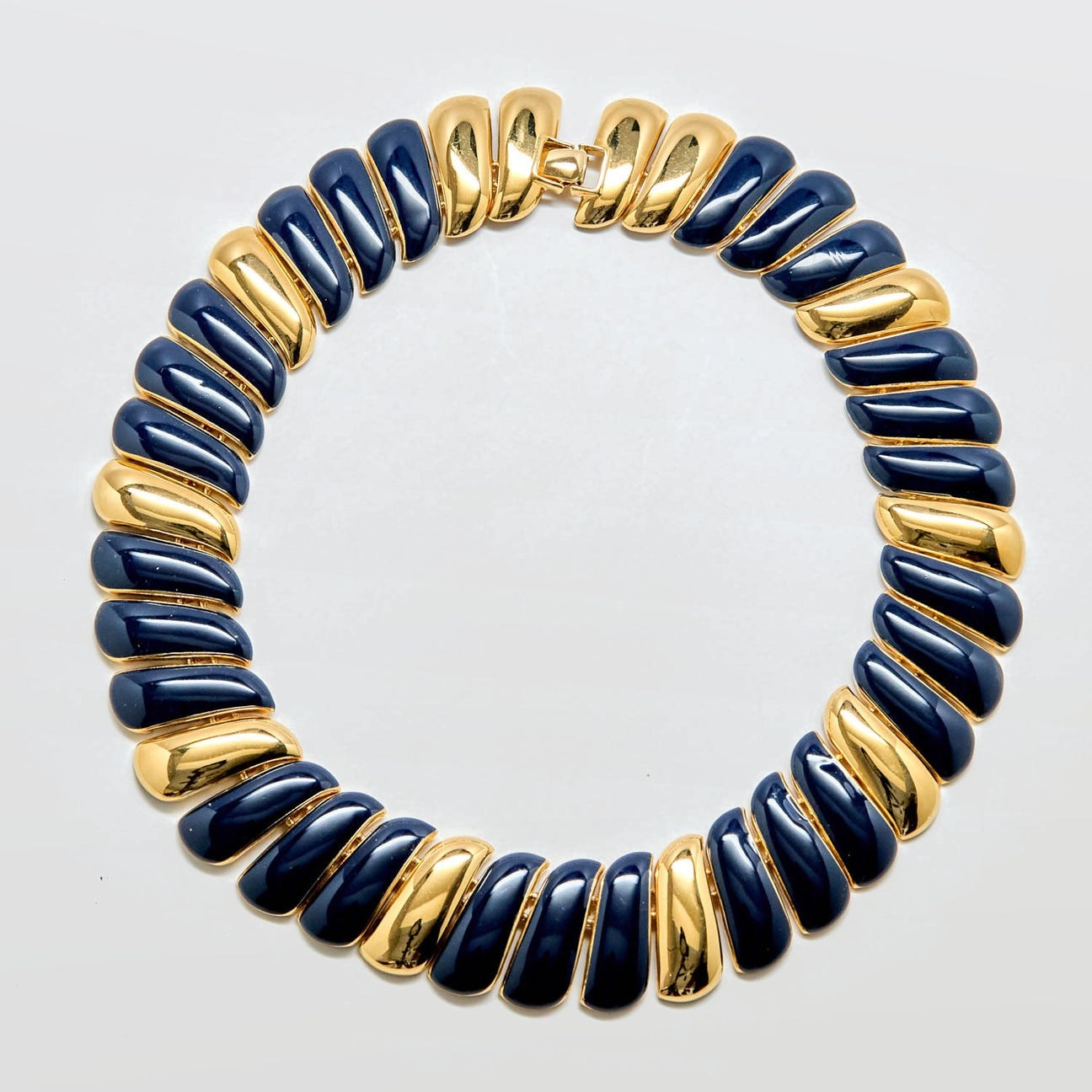 Necklace with blue and gold beads on a white background